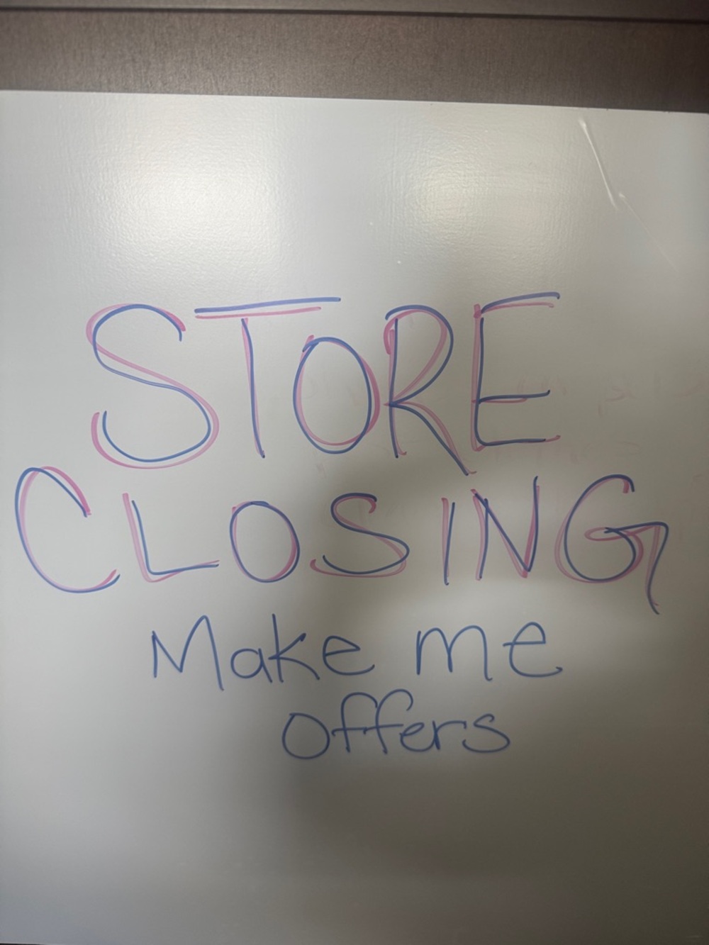 Whiteboard with Multicolor Marker Writing - "STORE CLOSING"